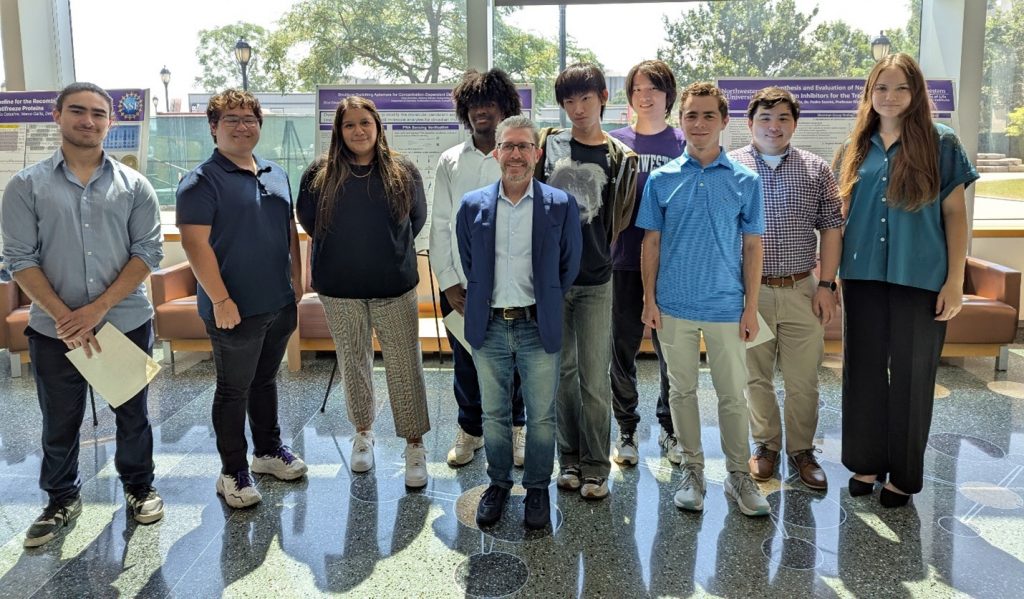 CLP undergraduate researchers gather with Institute director, Neil Kelleher, during the 2025 CLP Undergraduate Research Symposium in Silverman Hall. Undergraduate poster presenters from left to right: Nicholas Angulo (Lambert Fellow); Ethan Brazelton (Lambert Fellow); Litzi Gorostieta (I-SURE awardee); Neil Kelleher; Taray Sterling (CLP Summer Scholar); Tristan Weng (Lambert Fellow); Jerome Yang (Lambert Fellow); Julian Novin (Lambert Fellow); Michael Noonan (I-SURE awardee); and Katya Nogin (CLP Summer Scholar).